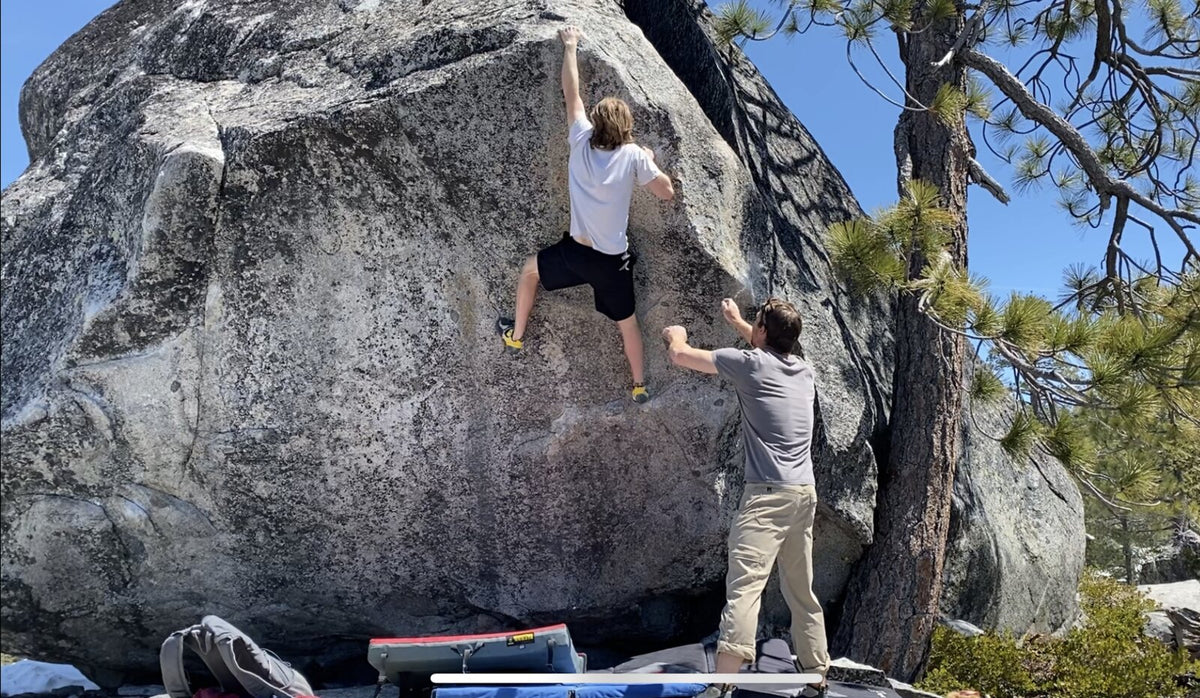 A climber and spotter on granite at Rainbow, Donner Pass near Truckee